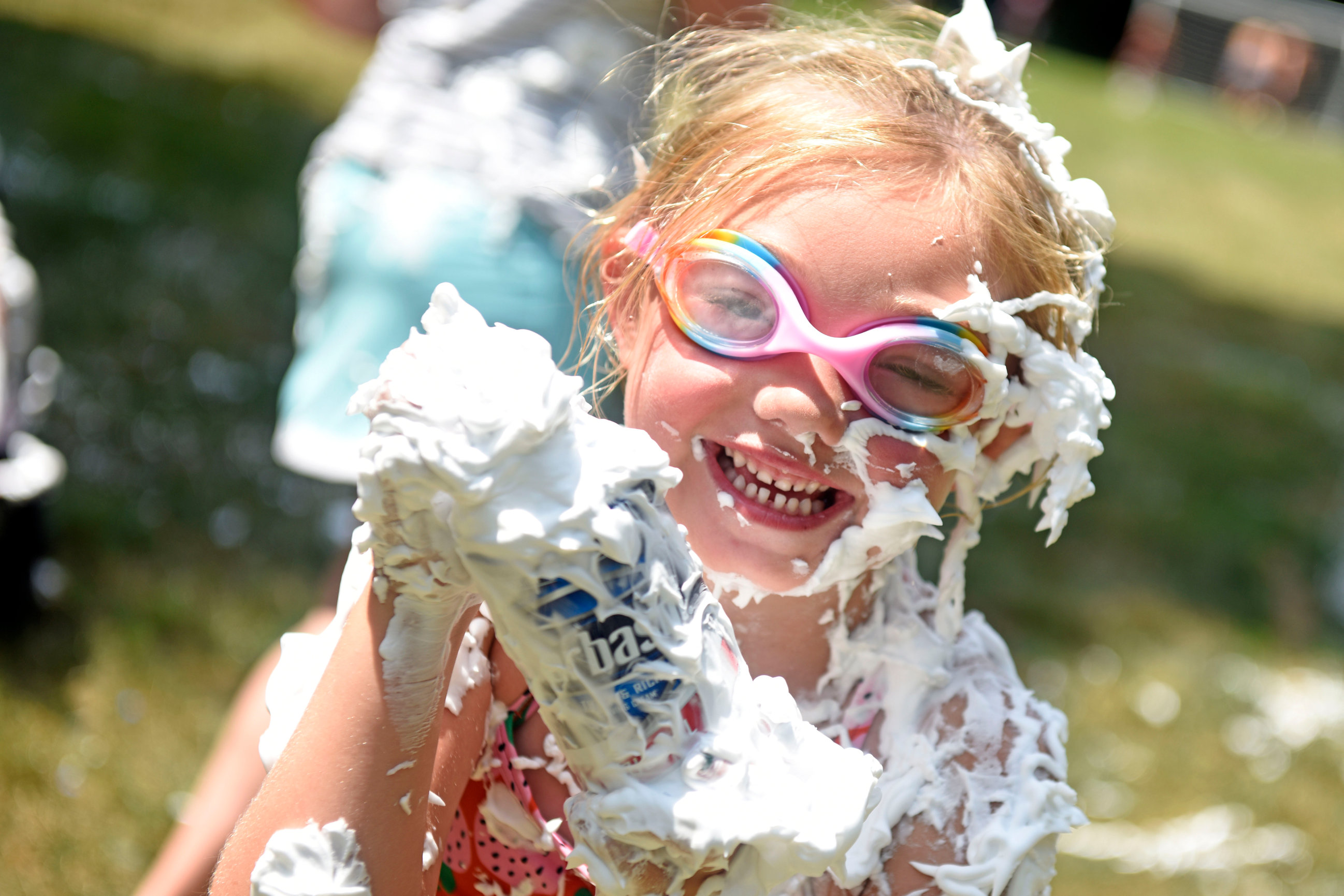 A photo of a Friendly youth covered in shaving cream during the pool's 2024 Fourth of July festivities.